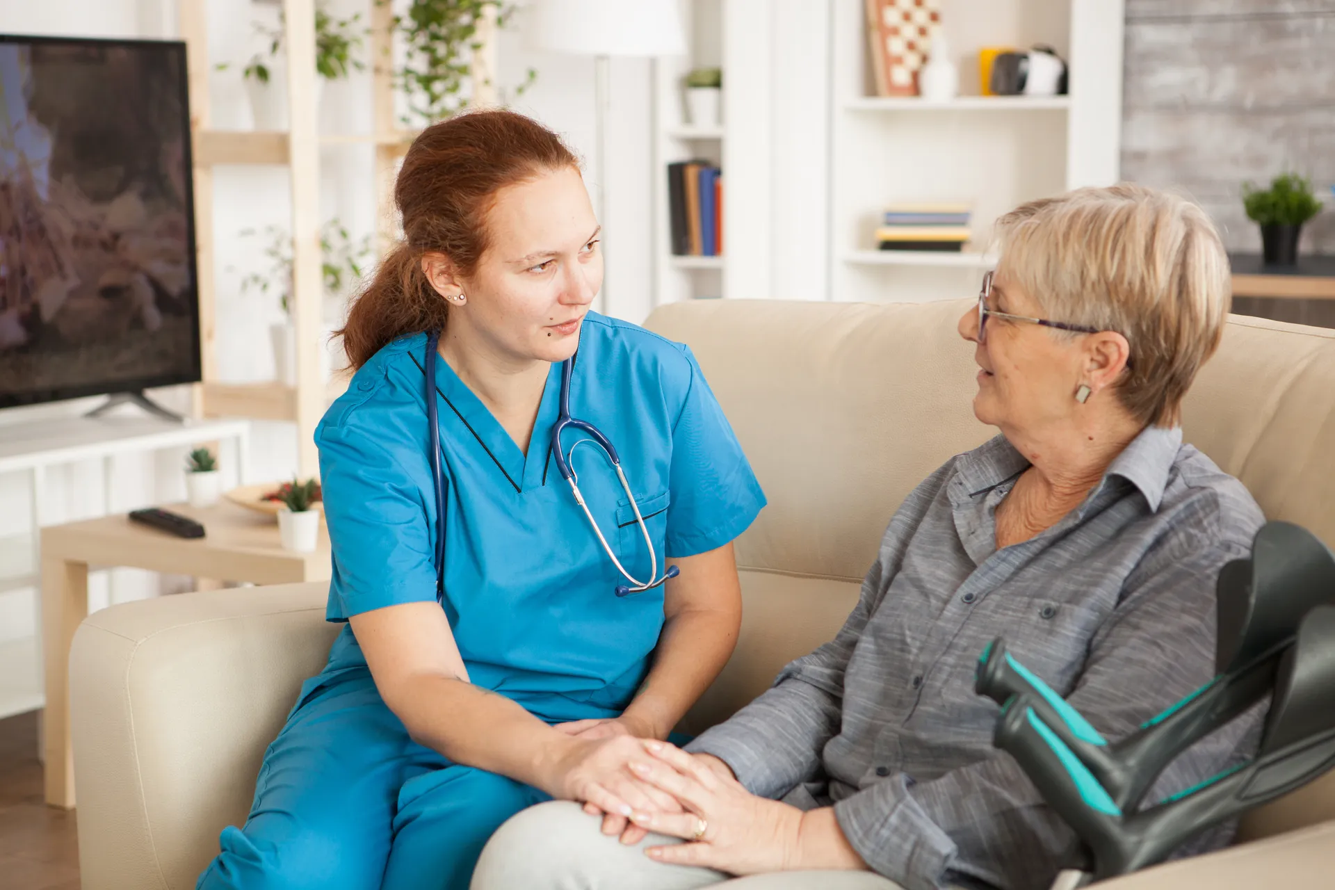 A nurse talking with an elderly patient